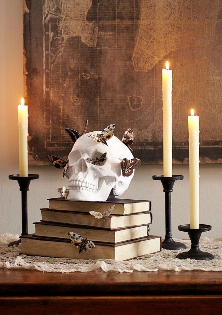 DIY skull, moths, books, and candles